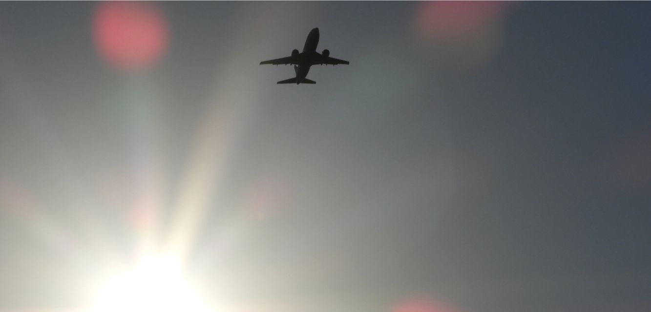 Airplane flying over the Northern Territory during sunset.