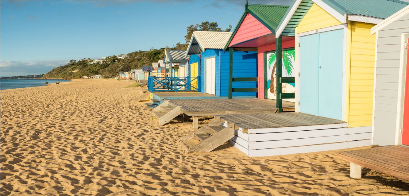 Colourful bathing boxes on Mills Beach in Mornington on the Mornington Peninsula near Melbourne, Victoria.