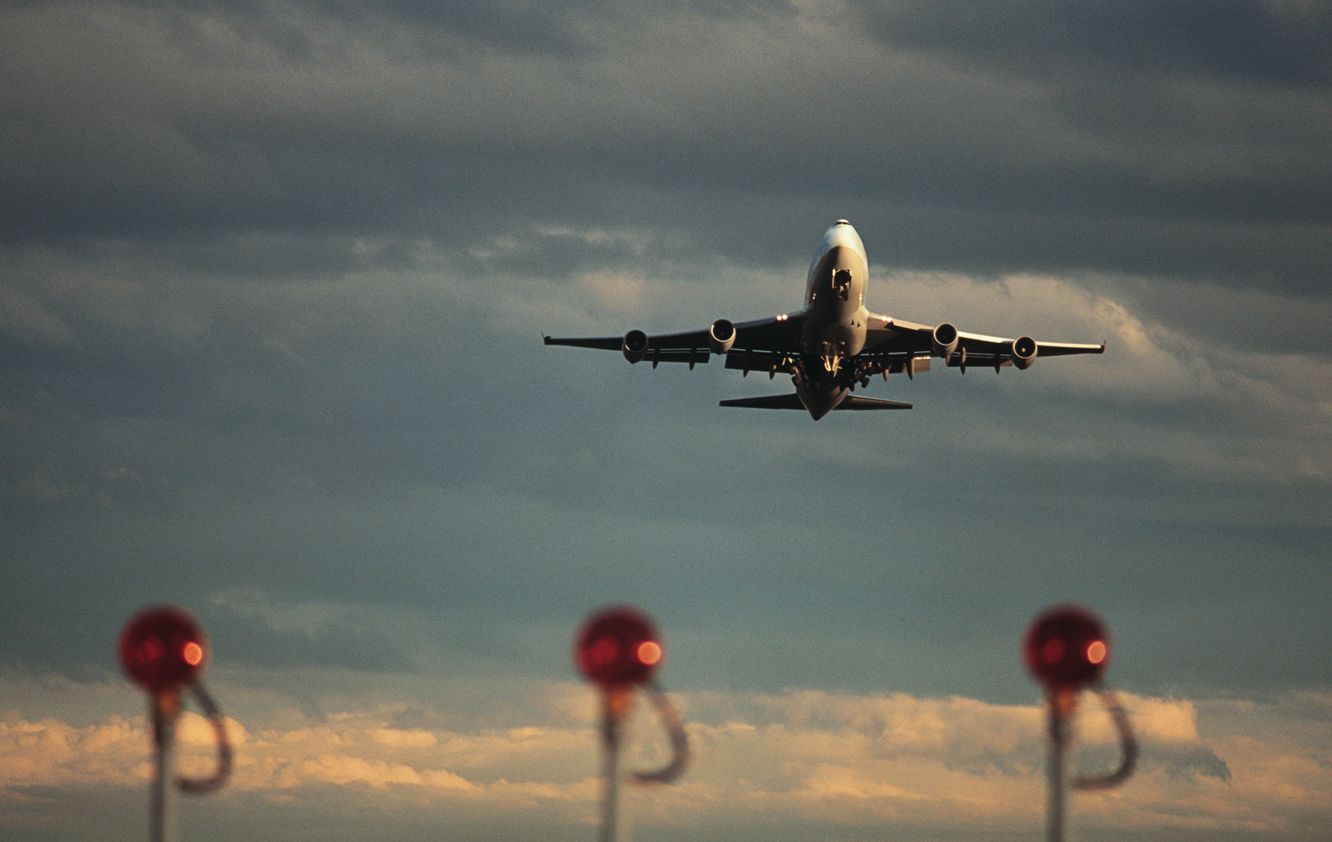 A 747 takes off from an airport in Australia.