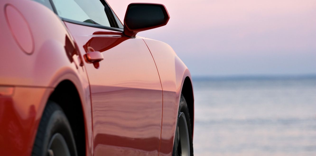 A luxury car at sunset.