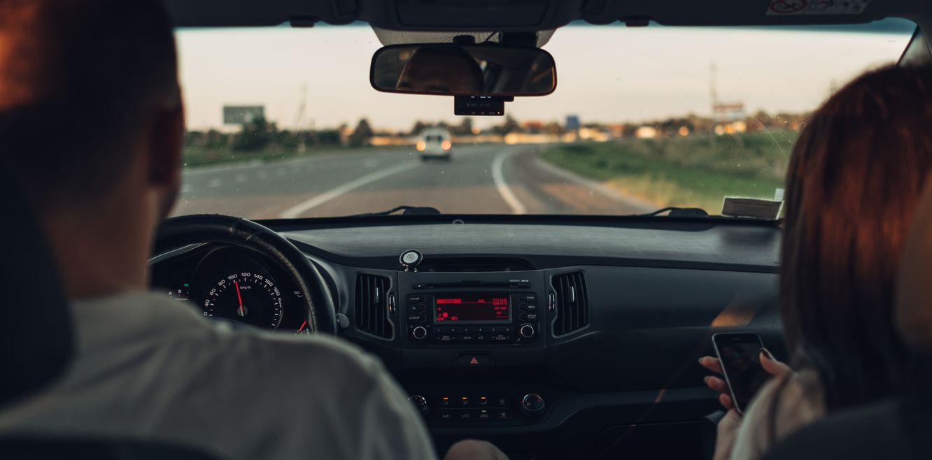 Couple driving in their car