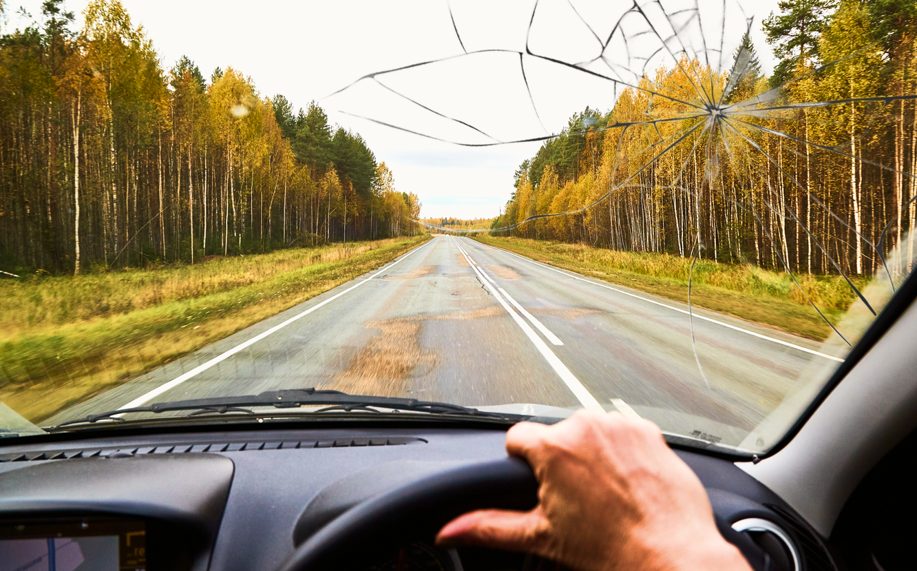 Broken windshield while driving a rental car.