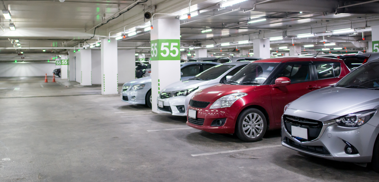 A selection of cars in a parking garage.